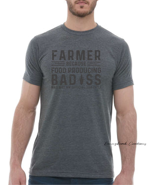 This design features a rustic font that reads "Farmer Because Food Producing Bad#@$ Was Not an Official Job Title" Everyday lightweight smooth & comfy tee.  (Slim Fit)