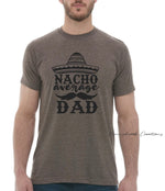 This design features a large sombrero style hat and reads "Nacho Average Dad" Everyday lightweight smooth & comfy tee.