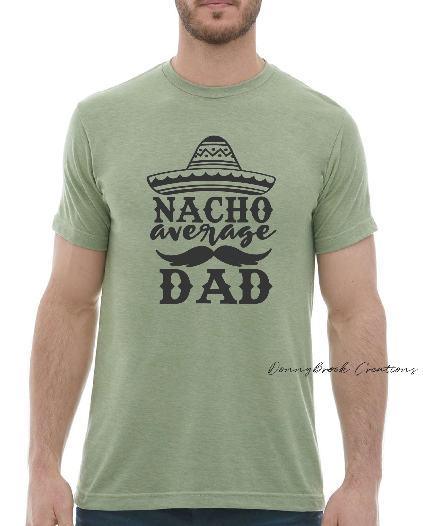 This design features a large sombrero style hat and reads "Nacho Average Dad" Everyday lightweight smooth & comfy tee. Available in Green/Blue/Grey or Brown